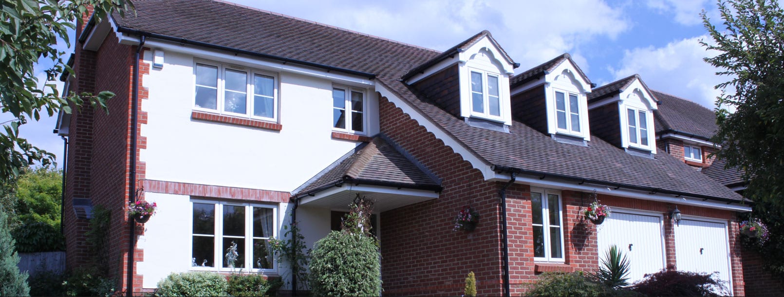 Hertfordshire Roofers and UPVC Fitters | Empire Roofing | UPVC large roofed home hero